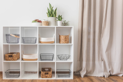 Modern white shelf with storage baskets